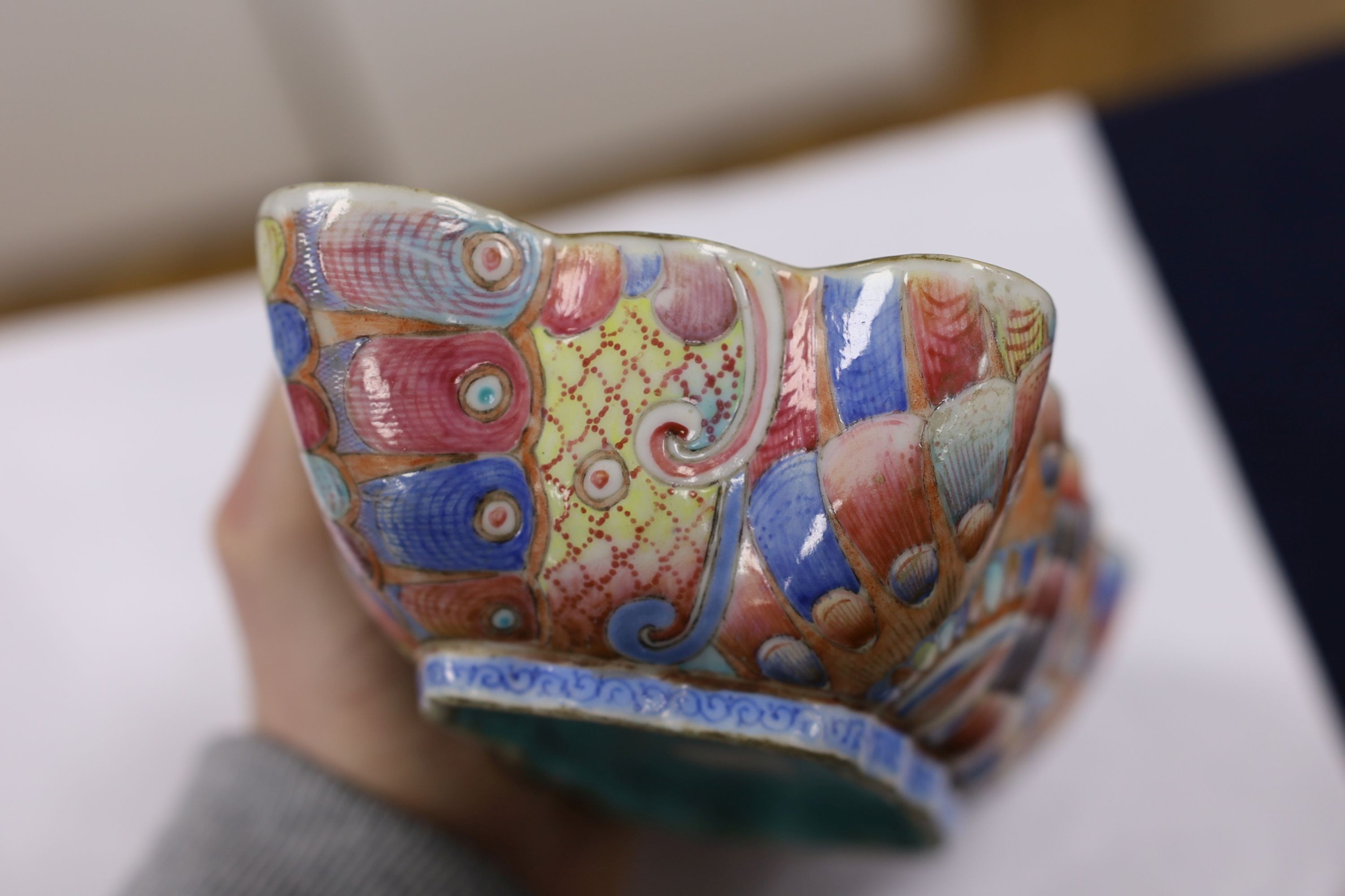 A Chinese enamelled porcelain ‘butterfly’ dish, 19th century, ground off reign mark, 19 cms wide at the front.